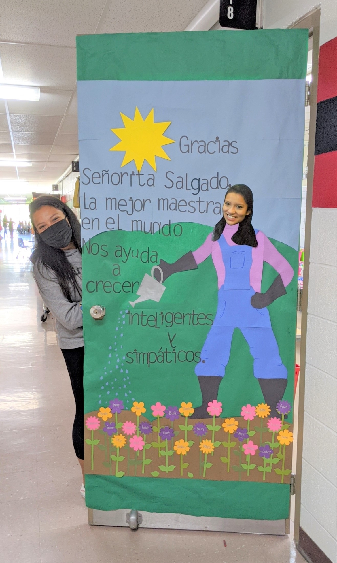 teacher with decorated spring door